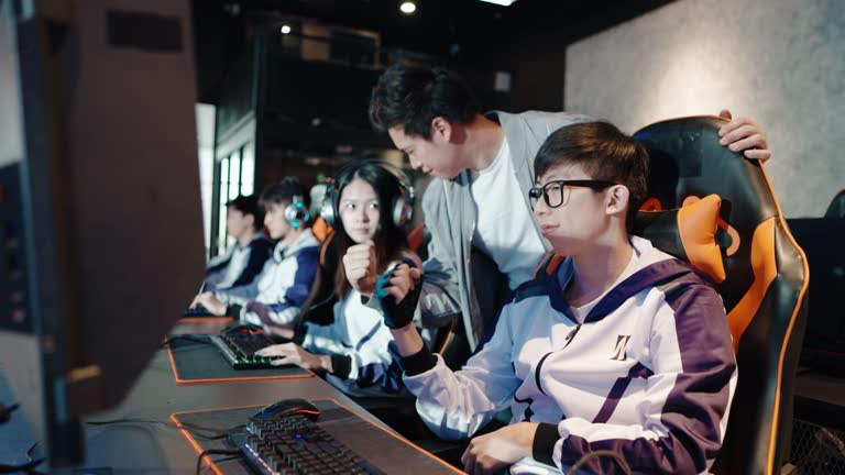 Asian Chinese Esport Team Coach final checking on team before the grand final of esport event Championship Arena. Cyber Games Tournament Event