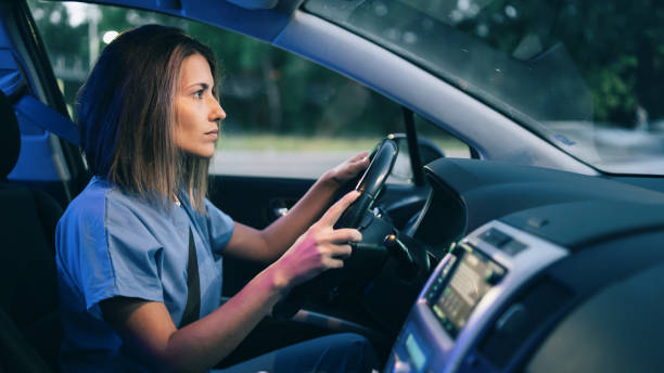 istock Female doctor driving home after a day's work 1413205262