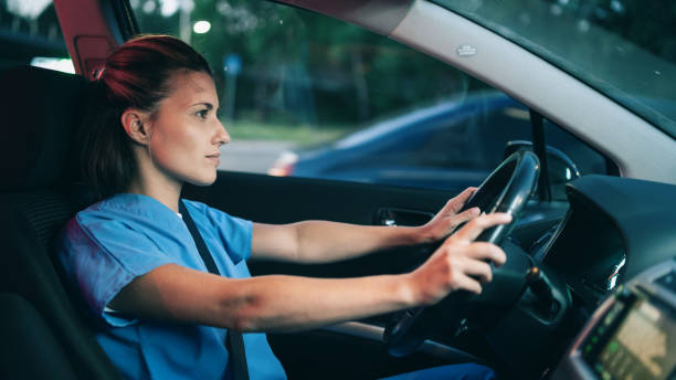 istock Female doctor driving home after a day's work 1413205264