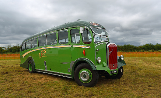 Little Gransden, Cambridgeshire, England - August 29, 2021:  Vintage Duple bodied Dennis Lancet Coach parked isolated on grass.