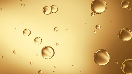 Beautiful texture transparent round bubbles float in yellow background champagne