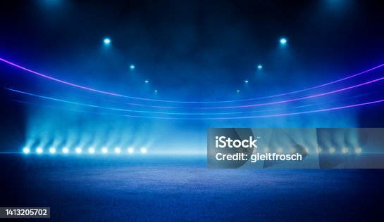 istock Abstract blue neon stadium background illuminated with lamps on ground. Science, product and sports technology background 1413205702