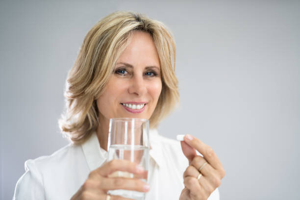 istock Woman Taking Medication Or Drugs 1413206508