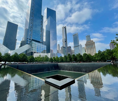 New York City, Lower Manhattan, USA, August 2022, USA.9/11 memorial site NYC GroundZero showing the hole where the twin tower were previously destroyed with sky scrapers in the background