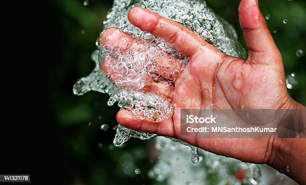 Fresh Pure Bubbling Water Splashing On Hand Stock Photo - Download Image Now - Below, Bubble, Catching