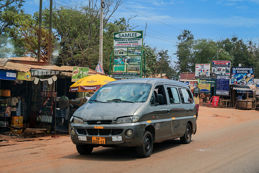 Kumasi, Ghana - April 06, 2022: Public Minibus  parked near the Local Ghana Market in Kumasi city