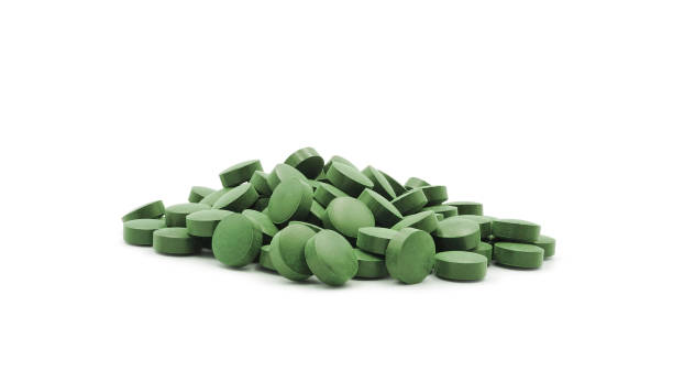 Spirulina tablets isolated on white stock photo