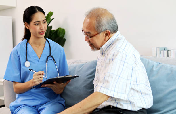 istock A nurse is examining the body and asking for symptoms from an elderly patient. 1413215984