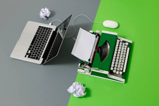 istock Digital und analog – Laptop and 70s Typewriter 1413216934