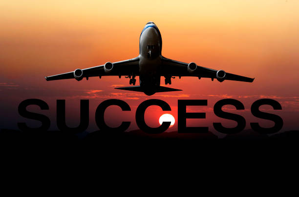 istock jet airplane is flying at sunset 1413219419