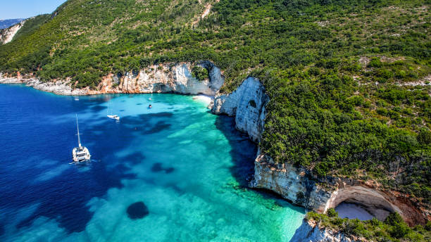 The beautiful beach Fteri Beach on the island of Kefalonia, Greece. A beautiful pebble beach on the clear emerald blue Ionian Sea. kefalonia stock pictures, royalty-free photos & images