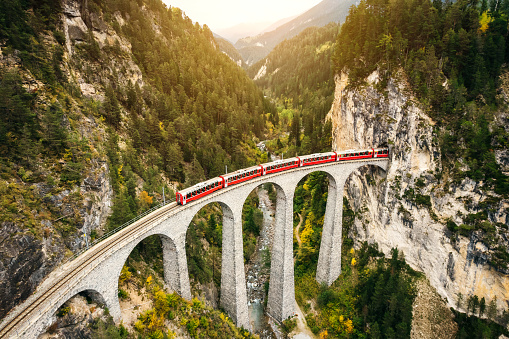 Train crossing Landwasser Viaduct on raethian railway in Filisur – Albula, Graubunden, Switzerland 
The Landwasser Viaduct is a single track limestone railway viaduct near Filisur in the canton of Graubünden, Switzerland.
