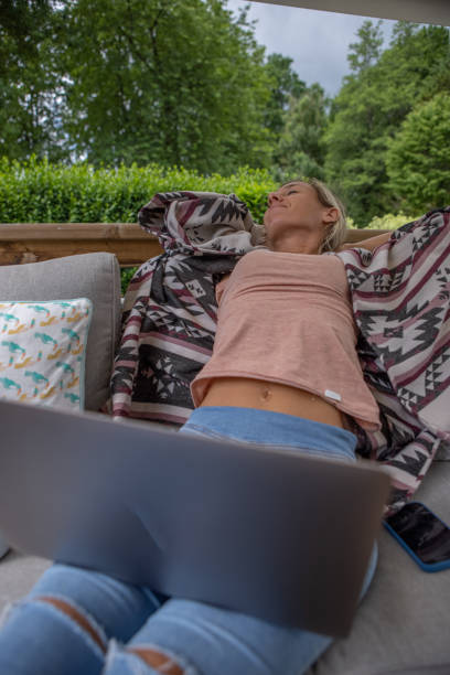 woman working from home - france holiday villa built structure vertical imagens e fotografias de stock