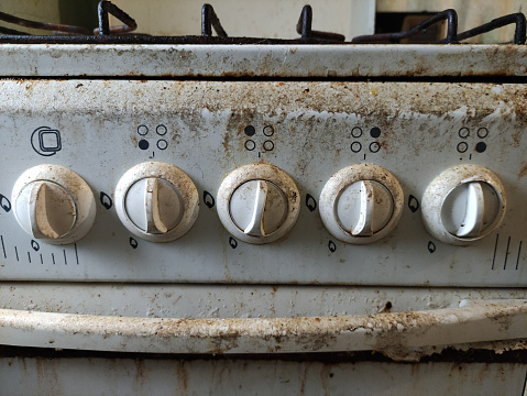 Very dirty and an old gas stove knobs