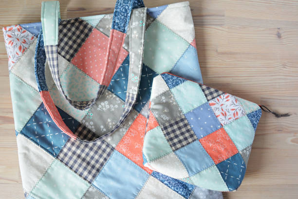 istock Quilted tote bag and notion pouch on wooden table 1413227049