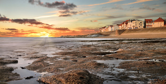 Landscape with the village of Ambleteuse in the English Channel at sunset