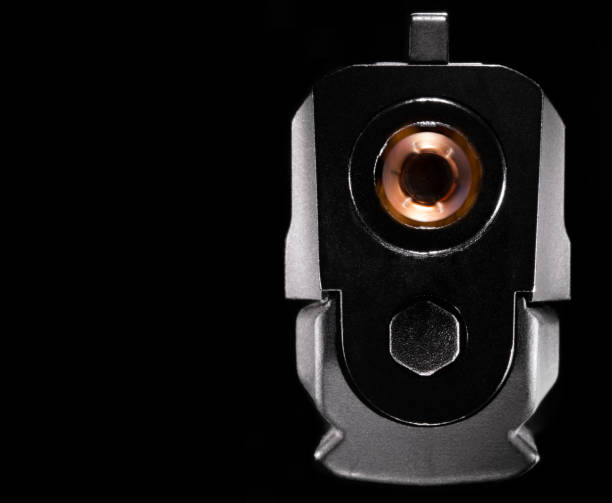 istock Semi auto handgun with bullet coming out 1413228519