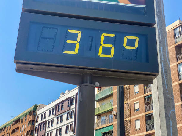 36 degrees celsius in the city Low angle view of billboard showing 36 degrees celsius of temperature in the city of Valencia, Spain Number 36 stock pictures, royalty-free photos & images