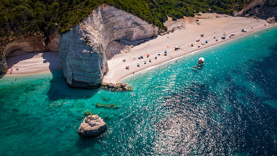 Fteri Beach on the island of Kefalonia, Greece. A beautiful pebble beach on the clear emerald blue Ionian Sea.