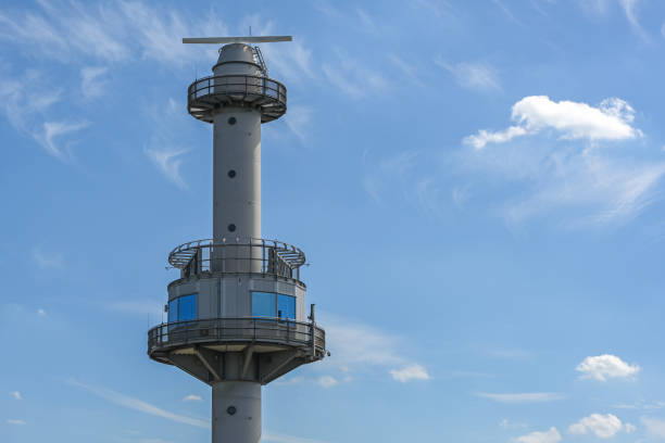 radar tower at the steinwerder coal ship harbor in the industrial cargo port of hamburg on the river elbe, concept for transport, navigation and safety at sea, blue sky, copy space - hamburg germany harbor cargo container commercial dock imagens e fotografias de stock