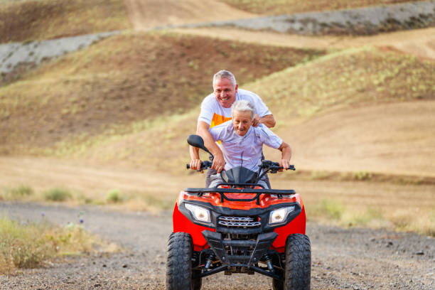 istock father and his  son  on an ATV quad biking 1413242226