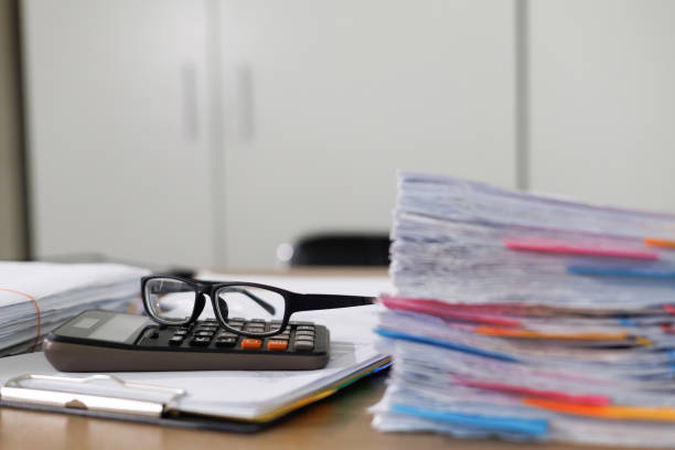 istock Business Documents concept  document achieves on folders papers at busy work desk office 1413242675