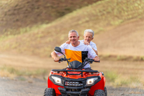 istock father and his  son  on an ATV quad biking 1413242719