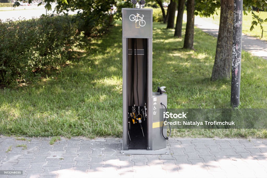 Automatic tire inflator for bicycle , this device is used to inflate the tyre with low air Free bicycle wheel inflation station. Automatic tire inflator for bicycle , this device is used to inflate the tyre with low air Bicycle Parking Station Stock Photo