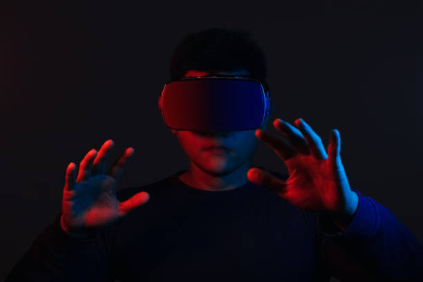 Young man wearing VR goggles. Metaverse technology virtual reality concept. Virtual Reality Device, Simulation, 3D, AR, VR, Innovation and Technology of the Future on Social Media.