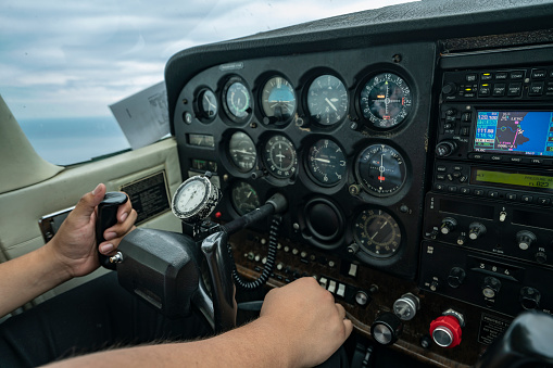 Inside of a fight simulator. View of controllers in cock pit of flight simulator of airplane.