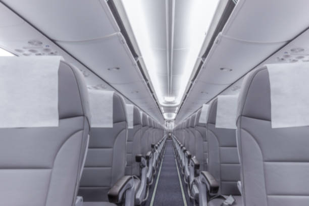 istock Blurred photograph.Perspective view of empty aircraft seats 1413250735