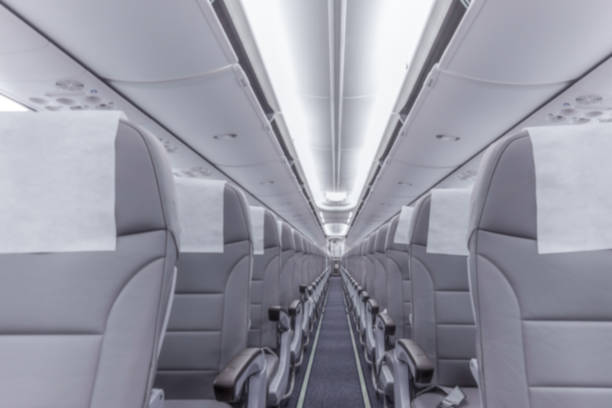 Blurred photograph.Perspective view of empty aircraft seats stock photo