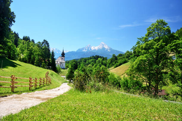 Pilgrimage Church Maria Gern (Wallfahrtskirche Maria Gern) and Watzmann mountain on background in Bavarian Alps, Berchtesgaden