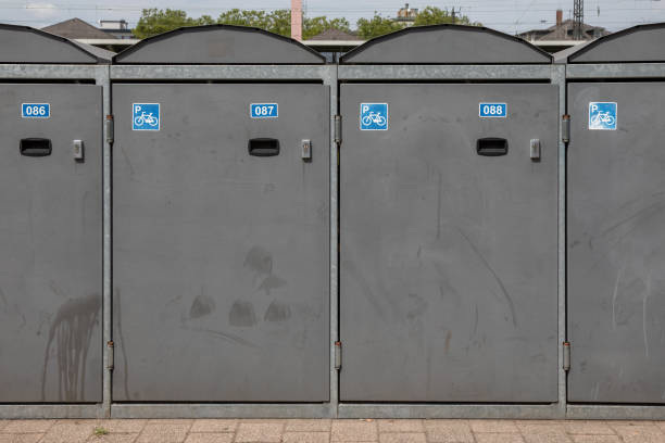 istock Lockable bicycle garages. Bicycle box parking lot lockable in grey 1413257515