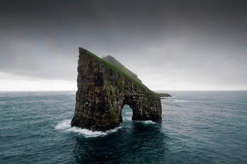 the natural arch of drangarnir beach  view from a cliff around in Vagar - Faroe Island