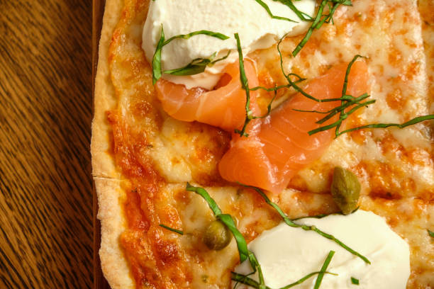 istock Pizza with bacon and ham and tomatoes 1413257928
