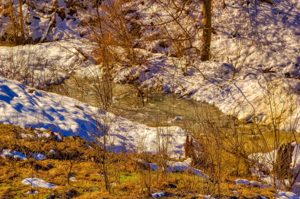 istock View over landscape covered with snow during sunny winter day. 1413258939