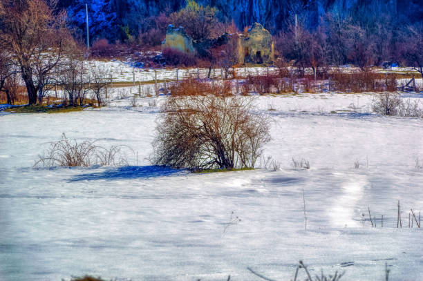 istock View over landscape covered with snow during sunny winter day. 1413259187