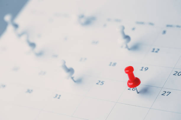 istock Embroidered red pins on a calendar event Planner calendar,clock to set timetable organize schedule,planning for business meeting or travel planning concept. 1413259281