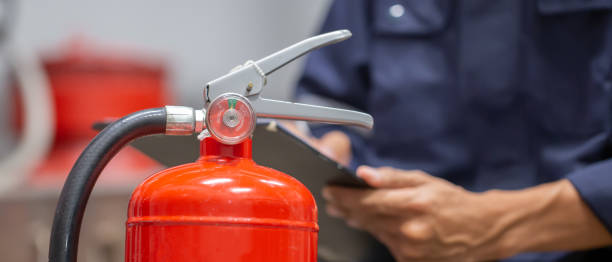 istock Engineer are checking and inspection a fire extinguishers tank in the fire control room for safety training and fire prevention. 1413259295
