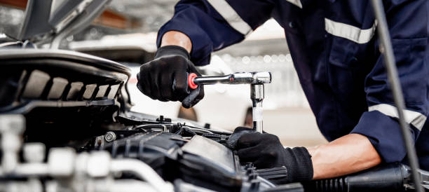 istock Car care maintenance and servicing, Close-up hand technician auto mechanic using the wrench to repairing change spare part car engine problem and insurance service support. 1413259854
