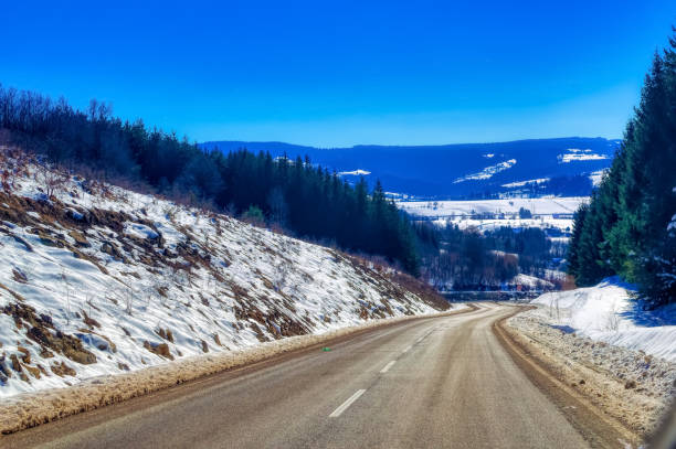 istock View over landscape covered with snow during sunny winter day. 1413260233