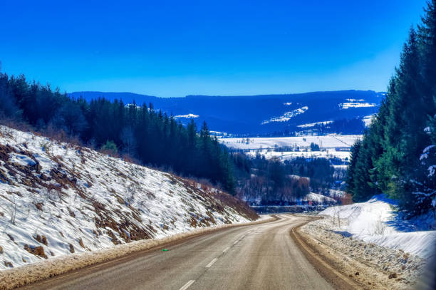 istock View over landscape covered with snow during sunny winter day. 1413260241