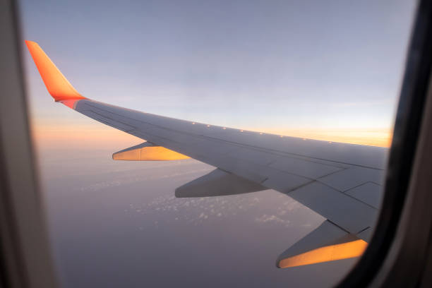 istock Sky, cloud during the sunrise from window of airplane. 1413261432