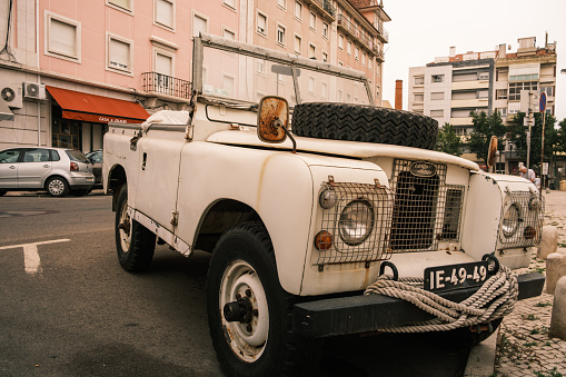 Lisboa , Portugal; 06 August 2022: white vintage land rover convertible parked on the street