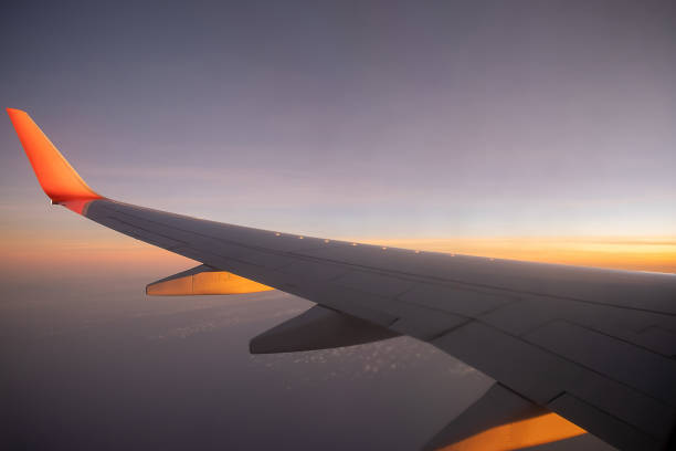 istock Sky, cloud during the sunrise from window of airplane. 1413261504
