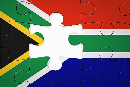 Representing national problems and solutions, a jigsaw puzzle with a gap for the last missing piece.