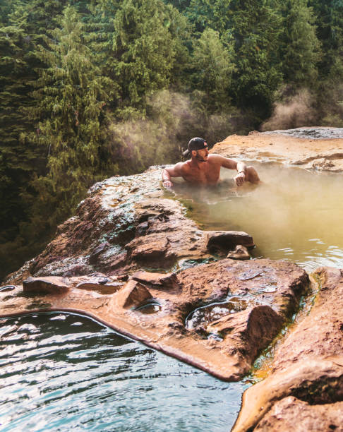 istock man resting in an hot spring in oregon 1413263086