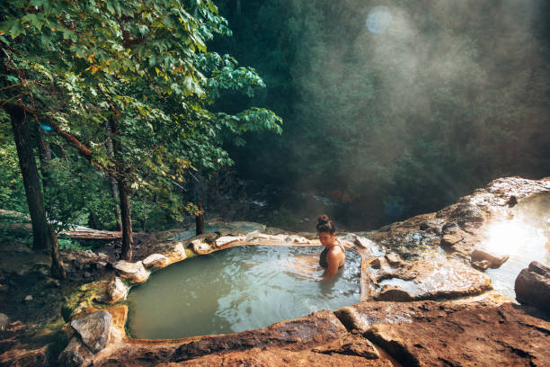 istock woman resting in an hot spring in oregon 1413263144