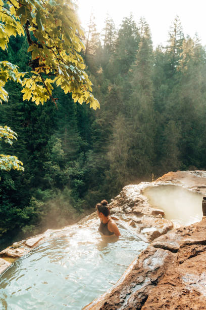 istock woman resting in an hot spring in oregon 1413263188